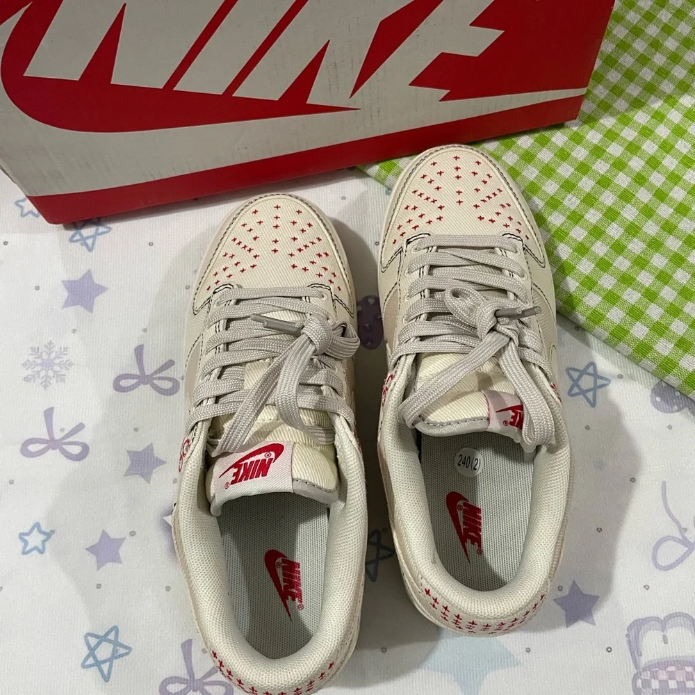 Nike Low-Top Sneakers in Cream with Red Details